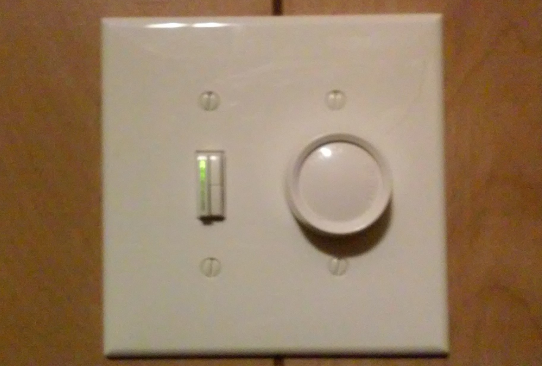 NWA Electric Installation of light dimmer/ fan switch combo.
